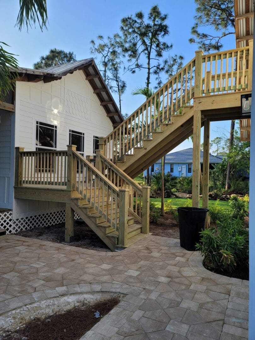 A house with stairs leading to the top of it.